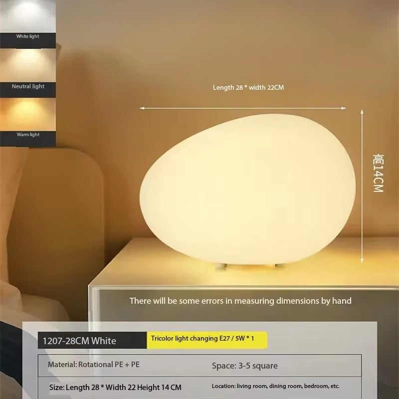 Cobblestone night light with E27 LED dimming bulb on a bedside table, showcasing modern minimalist design.